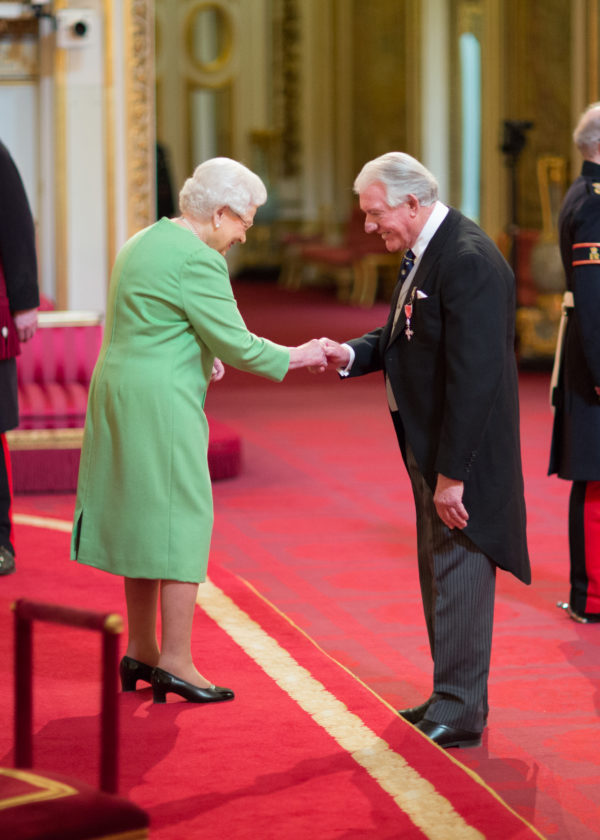 Angus Recieving Mbe From Queen Full Length Credit Image Courtesy Of British Ceremonial Arts Limited.